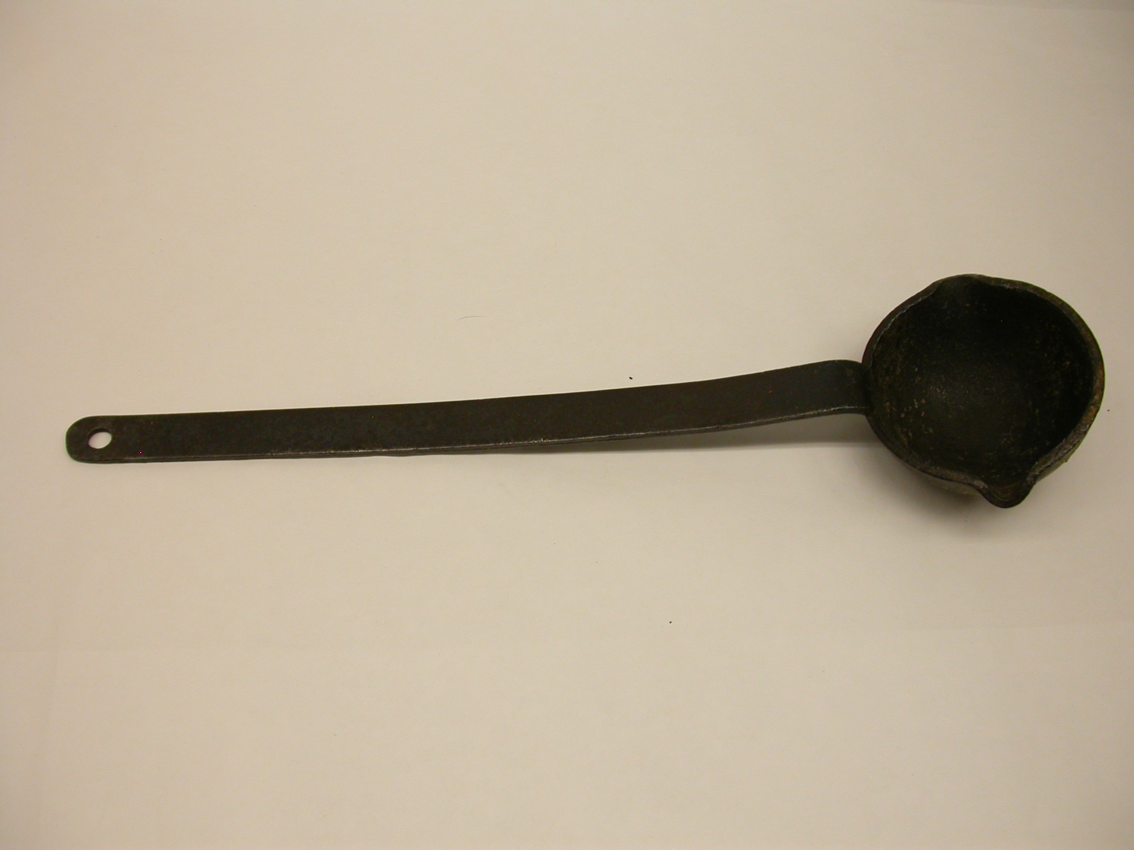 an%20iron%20ladle%20with%20pouring%20lip%20on%20each%20side%20of%20ladle%20bowl